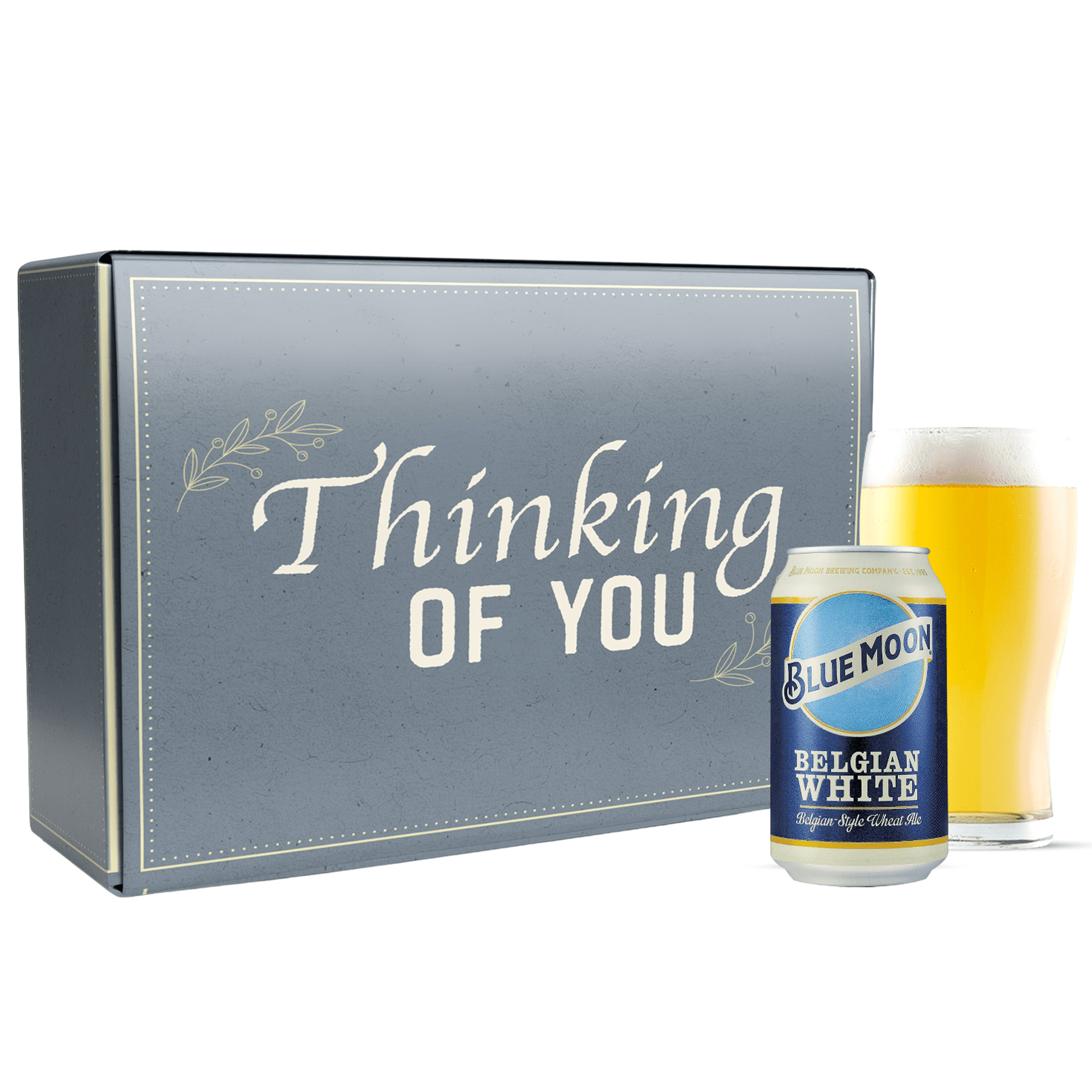 Blue Moon Belgian White beer can with a glass and 'Thinking of You' box on a white background