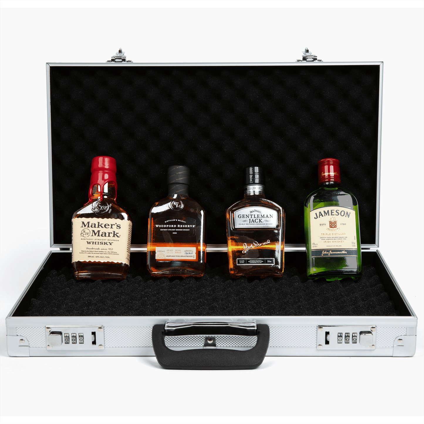 Open whiskey briefcase with four premium whiskey bottles displayed – luxury gift idea for whiskey lovers