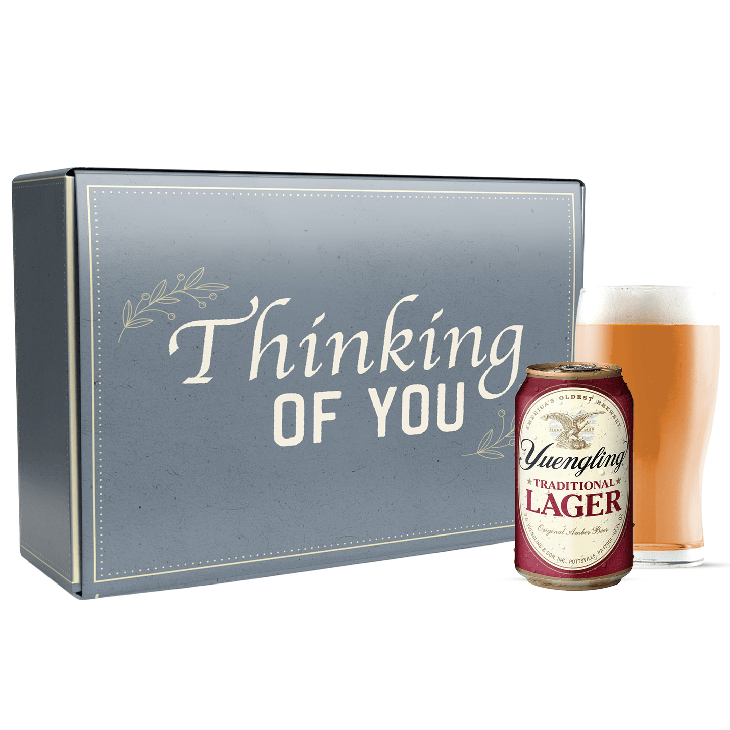 Gift box with 'Thinking of You' text and a can of Yuengling Lager next to a glass of beer.