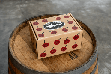 Dogfish Head with cherry design on a wooden barrel