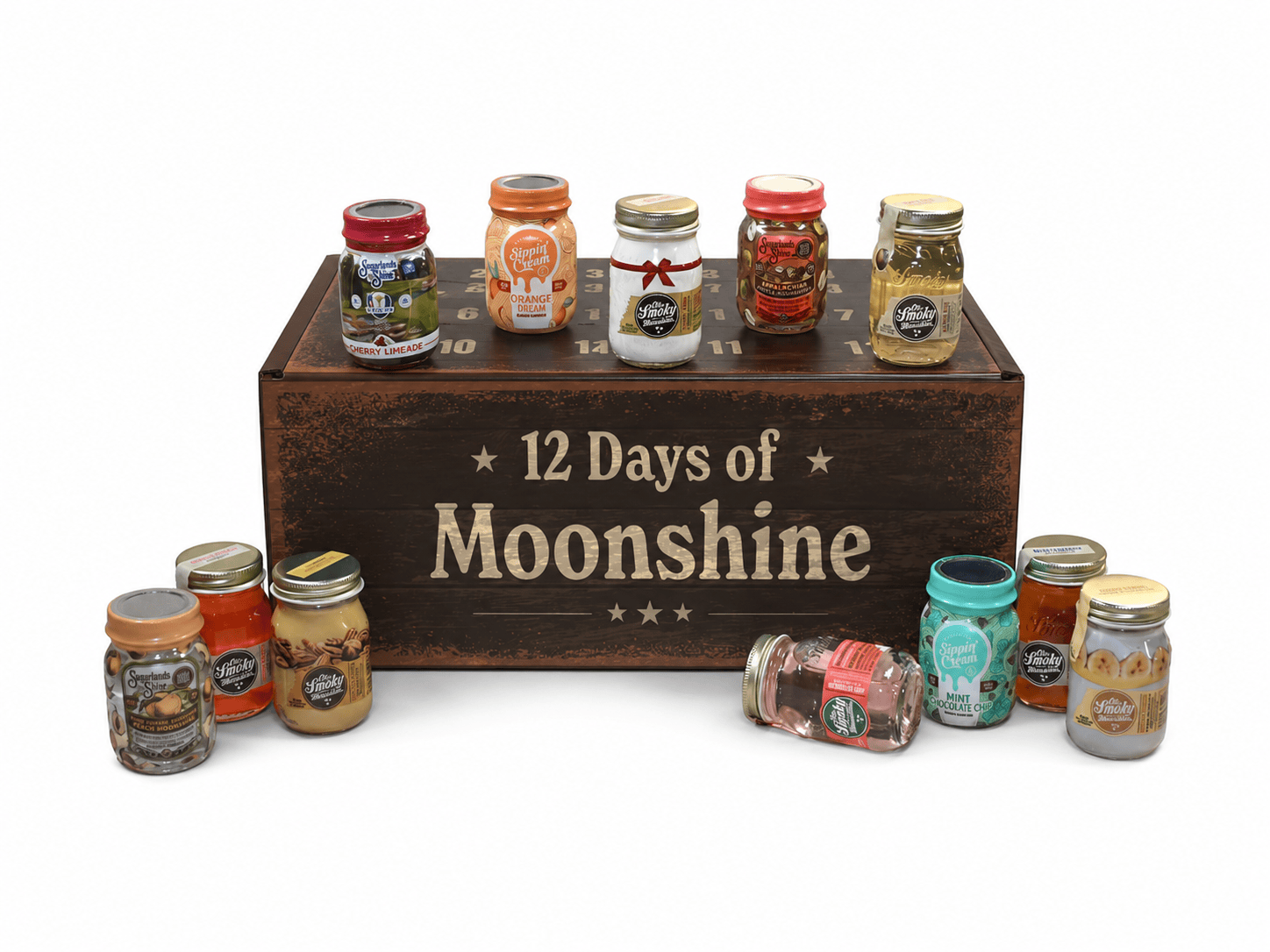 A 12-day moonshine cocktail mix kit displayed on a dark brown wooden crate labeled '12 Days of Moonshine'. The kit includes twelve small glass jars containing various colorful liquids and mix ingredients, arranged around the crate on a clean white background.
