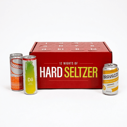 A red advent calendar box labeled '12 NIGHTS OF HARD SELTZER' with four hard seltzer cans placed in front on a clean white background. Visible brands on the cans include Dö and Bravazzi.