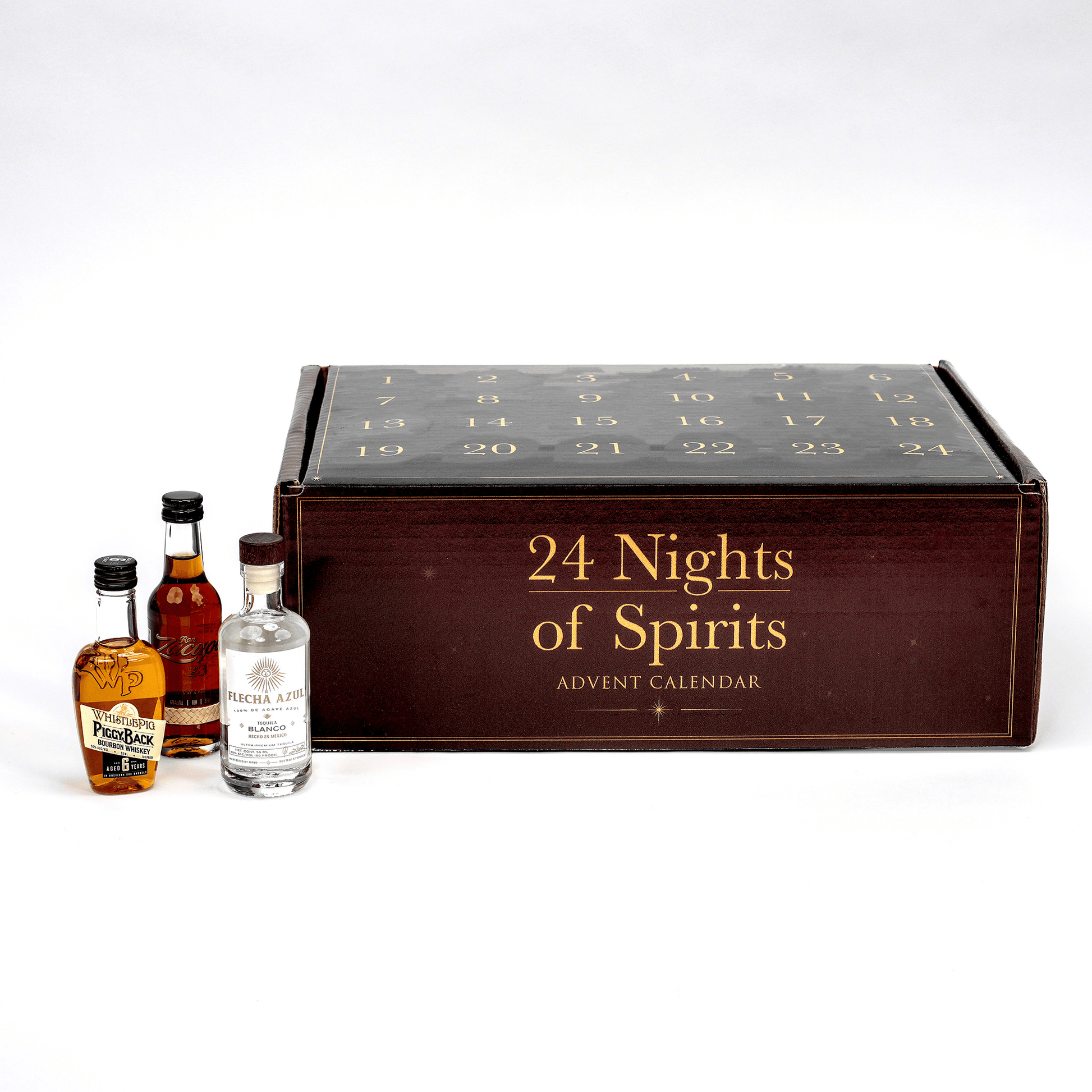 An advent calendarlabeled '24 Nights of Spirits Advent Calendar' in gold lettering on a dark wood-toned front, shown with three miniature spirit bottles in front on a clean white studio background.