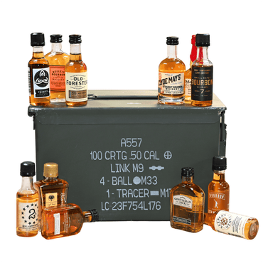 Collection of mini bourbon bottles around a military-style ammunition box on a white background