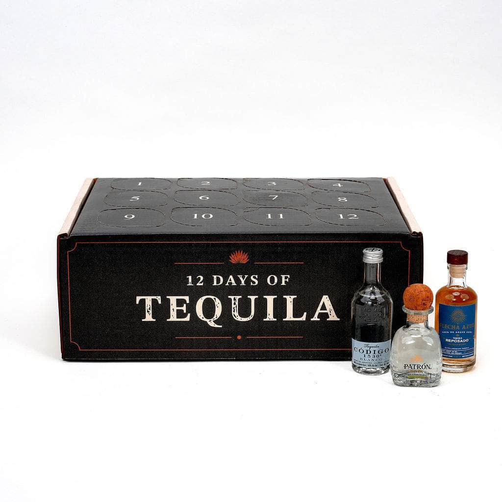 A 12-day tequila advent box set on a white background, featuring a black box labeled '12 DAYS OF TEQUILA' with 12 numbered compartments, alongside three small tequila bottles.